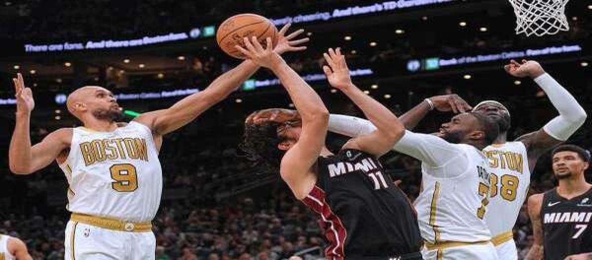 White scored 33 points and Brown added 30, as the Celtics defeated the Heat 129-116.