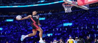 Keisha Johnson narrowly defeats Carter Bryant to win the Slam Dunk Contest.